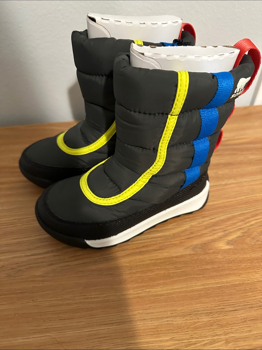 Sorel Kids Black Boots with Yellow & Blue Accents